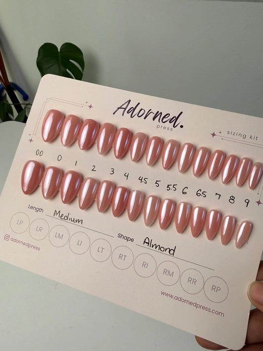 28 press ons of different sizes on backing card pink and chrome finish medium almond