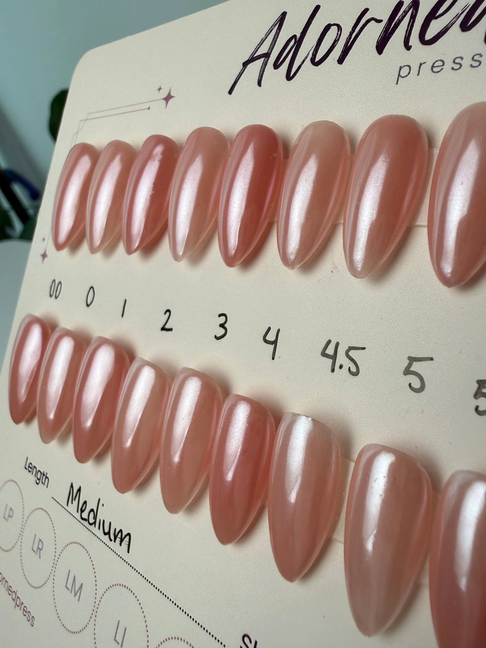 pink and chrome finish medium almond press ons close up