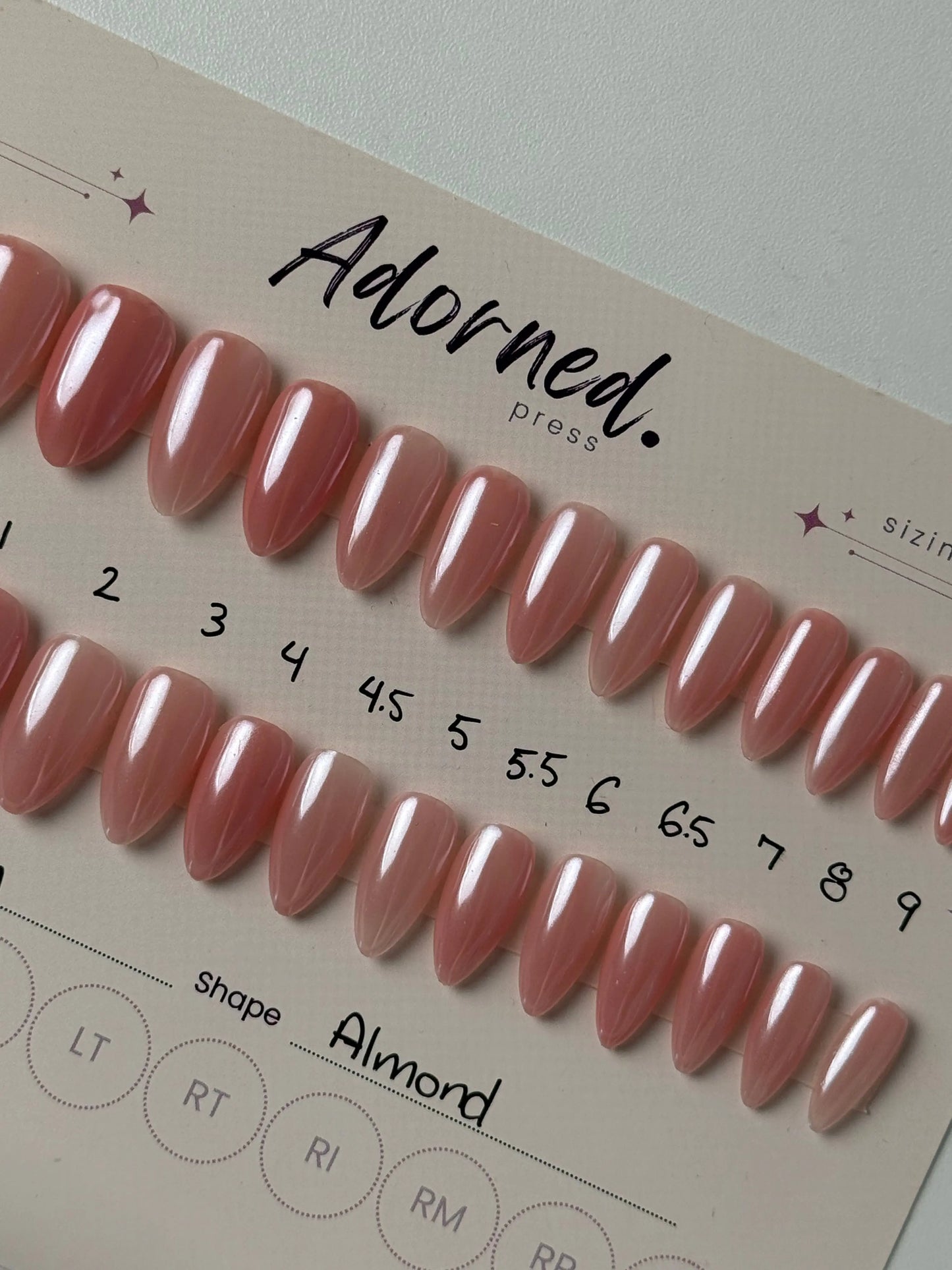 28 press ons of different sizes on backing card pink and chrome finish medium almond