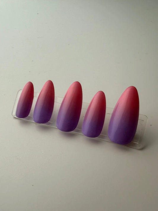 Pink to purple sunset gradient on medium almond press ons