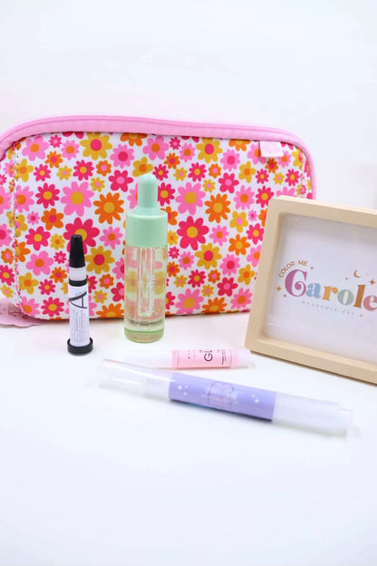springtime pouch, cuticle oil, nail glue, and press on storage on white background